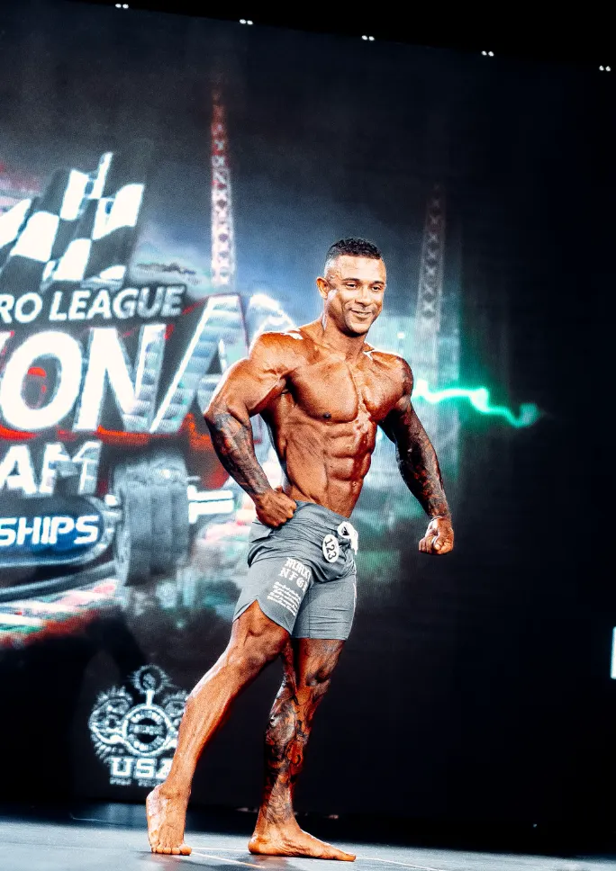 Jorge Luis Torres on stage at a physique competition